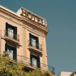 a hotel sign on top of a building